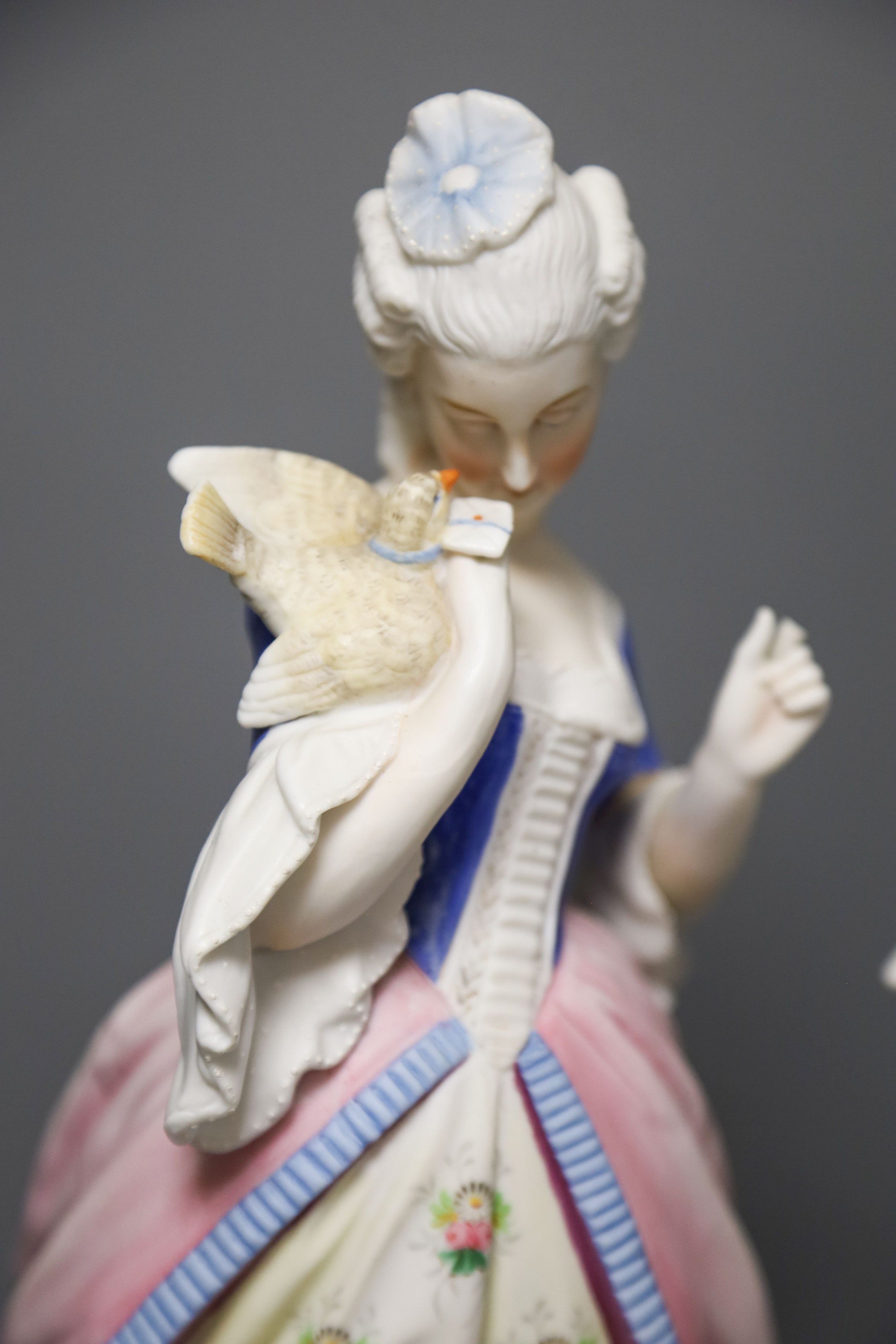 A pair of 19th century French bisque figures of a lady and gentleman 37cm